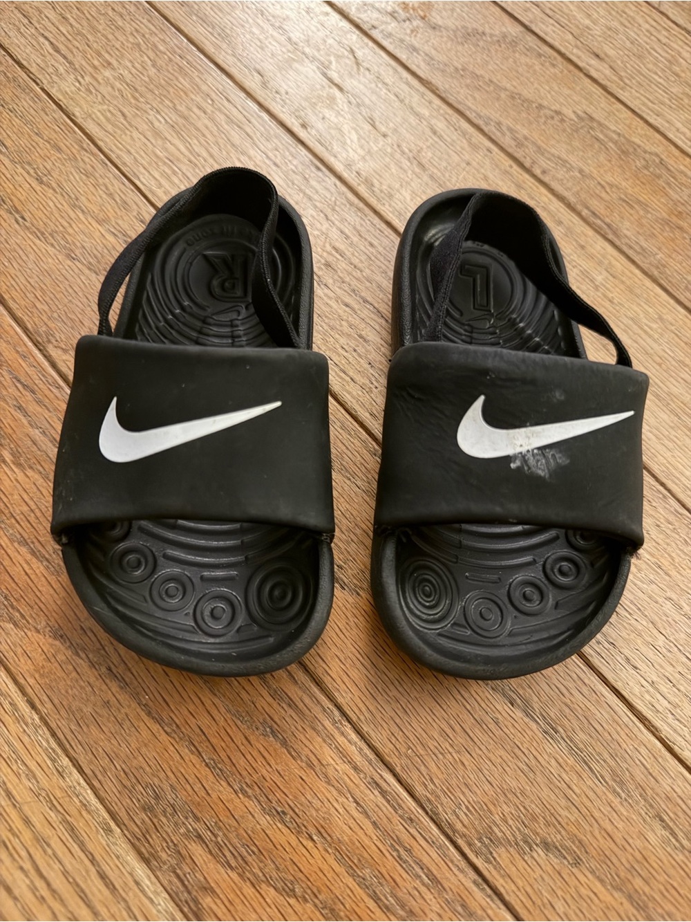 Nike Kids Black Slide Sandals with White Swoosh Logo
